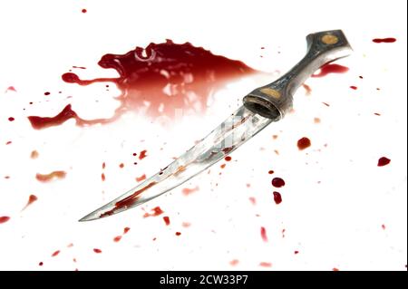 A knife is covered with a fresh blood. Isolated on white