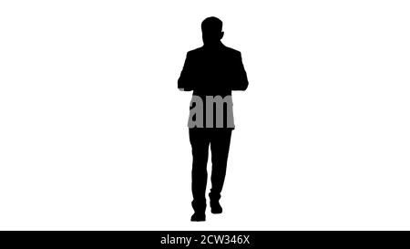 Businessman walking and using the phone, Alpha Channel Stock Photo