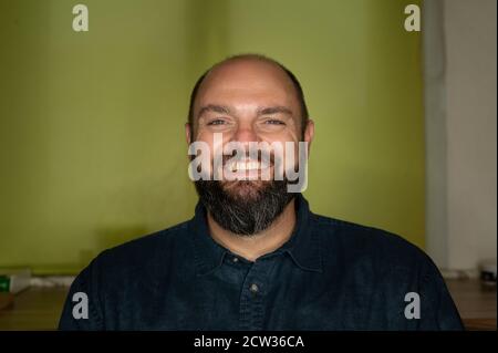 Man smiles friendly at the camera Stock Photo
