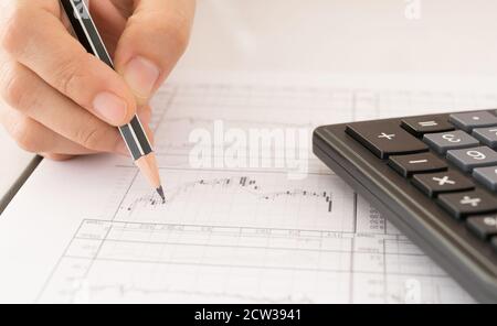 Financial Advisor stock market graphs analysis. Investment, Analysis, Financial Services Concept. Stock Photo