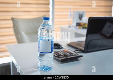 Plastic water bottle on the office desk Stock Photo