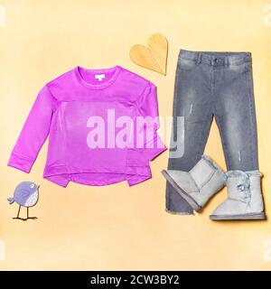 Purple girl top cloth with a jeans pants isolated Stock Photo