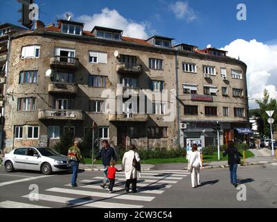 Some houses have traces of shooting from the war time on the walls Stock Photo