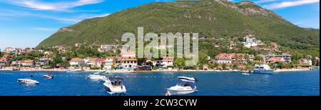Houses and yacts on the coast of the Adriatic sea, Kotor Bay, Montenegro Stock Photo