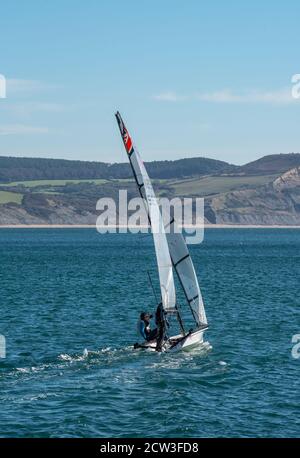 Lyme Regis, Dorset, UK. 27th Sep, 2020. UK Weather: A bright and sunny day with a chilly wind at Lyme Regis. People make use of the breezy conditions to enjoy a morning of sailing in Lyme Bay, West Dorset. Credit: Celia McMahon/Alamy Live News Stock Photo