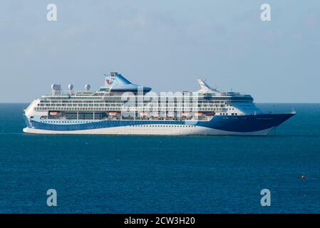 Weymouth, Dorset, UK.  27th September 2020.  The empty TUI cruise ship Marella Discovery at anchor on a sunny morning in Weymouth Bay off the coast of Weymouth in Dorset during the cruising shutdown because of Covid-19. Picture Credit: Graham Hunt/Alamy Live News Stock Photo
