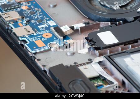 Image depicting an open laptop computer showing the components, circuits and chips inside Stock Photo