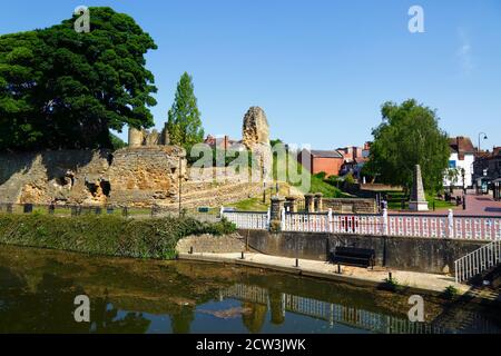 Walls of Tonbridge Castle reflected in River Medway, High Street on far right, Tonbridge, Kent , England Stock Photo