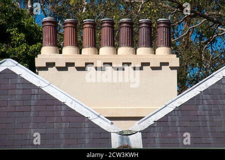 Sydney Australia, row of chimney pots on roof of historic cottage Stock Photo
