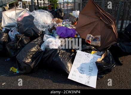Hong Kong, Hong Kong, China. 30th Sep, 2014. The 2014 Umbrella revolution takes hold with police withdrawing leaving protestors in charge and roads barricaded.Dawn breaks on the 2nd morning after the protests. Protest slogans litter the area. Rubbish is ready for collection Credit: Jayne Russell/ZUMA Wire/Alamy Live News Stock Photo