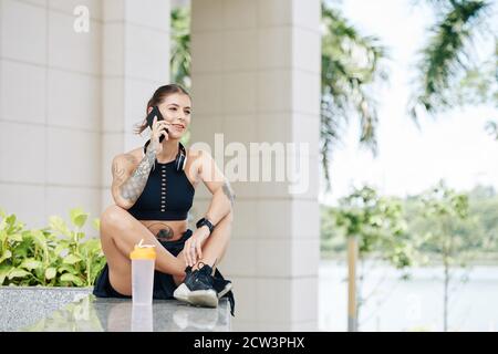 Fit young talking on phone Stock Photo