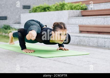 Flexible woman doing plank Stock Photo