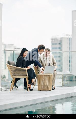 Entrepreneurs discussing project overview Stock Photo