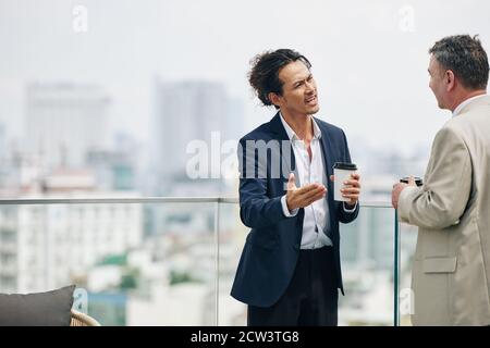 Businessman trying to prove his point Stock Photo
