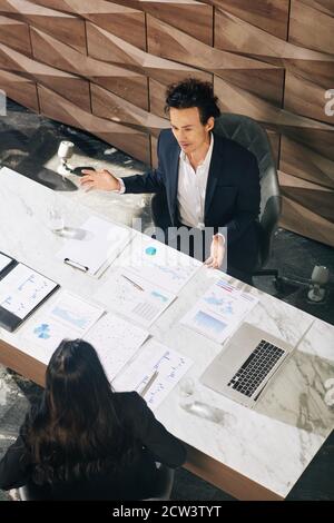 Business people discussing reports Stock Photo