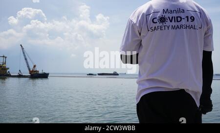 Manila, Philippines. 26th Sep, 2020. Manila COVID-19 Safety Marshalls guarding the vicinity of Manila Bay for people swimming at the sea and reprimanding passerby going near the rehabilitated part of Manila Bay (Photo by Sammy Sahiddil/Pacific Press) Credit: Pacific Press Media Production Corp./Alamy Live News Stock Photo