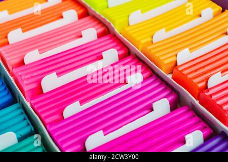 Rainbow colors of modeling clay. Multicolored plasticine bars ina box,  background texture 10602231 Stock Photo at Vecteezy