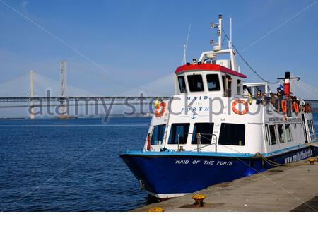 South Queensferry, Scotland, UK. 27th Sep 2020. Fine weather brings out the visitors to South Queensferry, seen here boarding the Maid of the Forth at Hawes Pier for a trip around the Forth bridges and estuary. Credit: Craig Brown/Alamy Live News Stock Photo