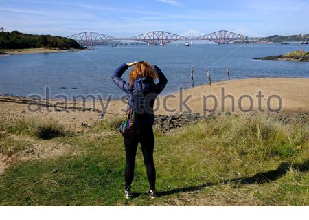 South Queensferry, Scotland, UK. 27th Sep 2020. Fine weather brings out the visitors to South Queensferry. Viewing the Forth Bridges. Credit: Craig Brown/Alamy Live News Stock Photo