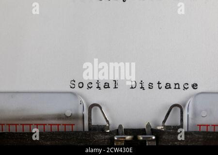 written on old typewriter with text Social Distance. Covid-19, Coronavirus concept Stock Photo