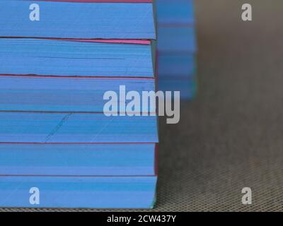 Light rose color bill books or receipt books on a cream color furnishing cloth, close up shot Stock Photo