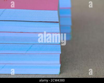 Light rose color bill books or receipt books on a cream color furnishing cloth, close up shot Stock Photo
