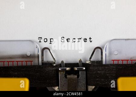 written on old typewriter with text Top secret Stock Photo