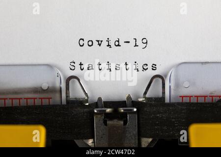 written on old typewriter with text Covid-19 Statistics.  Covid-19, Coronavirus concept Stock Photo