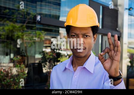 Portrait of professional architect in protective yellow helmet . Engineer and architect concept. Stock Photo