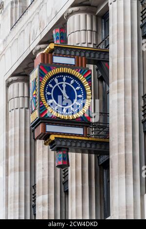 Ornate Art Deco Clock on the former Daily Telegraph Building in Fleet Street, London. The Building (now Peterborough Court) houses Goldman Sachs Stock Photo