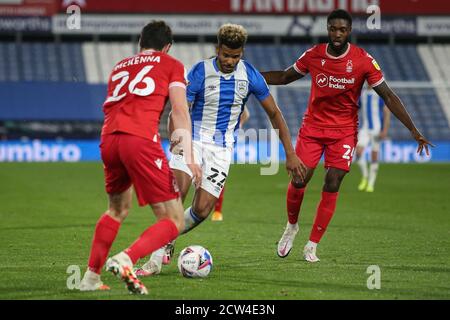 Fraizer Campbell (22) of Huddersfield Town runs at Scott McKenna (26) of Nottingham Forest Stock Photo