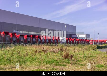 Line of parked dlivery lorries parked at Royal Mail sorting depot ...