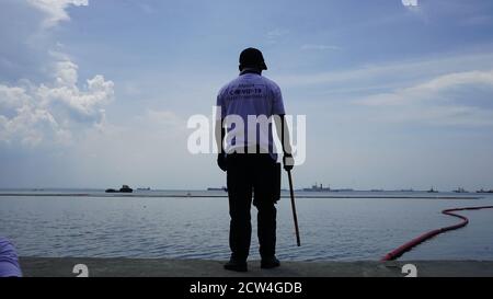 Manila, Philippines. 26th Sep, 2020. (9/26/2020) Manila COVID-19 Safety Marshalls guarding the vicinity of Manila Bay for people swimming at the sea and reprimanding passerby going near the rehabilitated part of Manila Bay (Photo by Sammy Sahiddil/Pacific Press/Sipa USA) Credit: Sipa USA/Alamy Live News Stock Photo