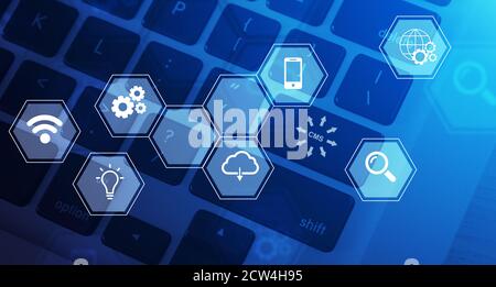 Top view of computer keyboard with CMS button, content management system related icons on virtual screen, collage Stock Photo