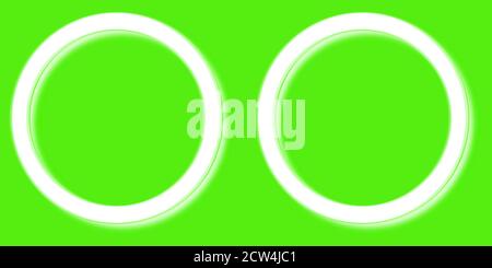 two white round frames on a green background for paintings Stock Photo