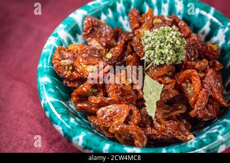 A small Sicilian 'lemmo' full of dried cherry tomatoes Stock Photo