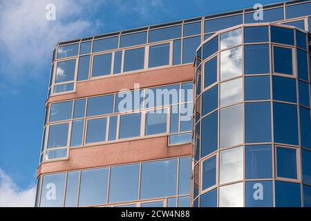 Glass facade of an abandoned office complex Stock Photo