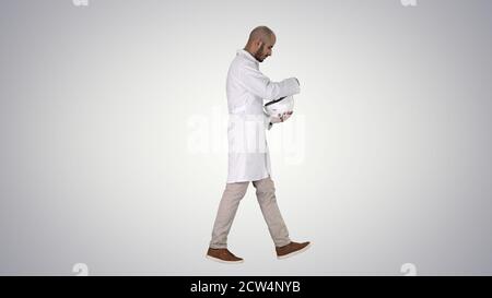 Science engineer walking and putting helmet on Safety concept on Stock Photo