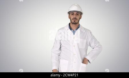 Scientist engineer in safety glasses and hard hat walking Safety Stock Photo
