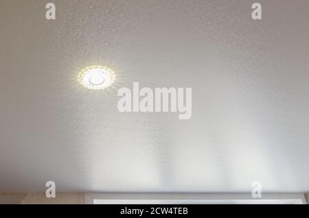 Ceiling in the room with spotlights installed and turned on Stock Photo