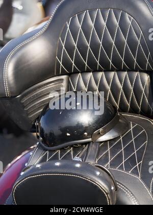 Black, shiny motorcycle helmet and leather biker gloves Isolated on white background Stock Photo