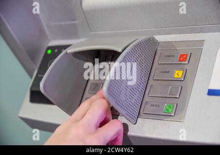 Close-up of hand entering PIN/pass code on ATM/bank machine keypad Stock Photo