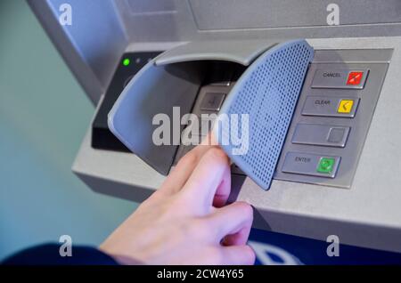 Close-up of hand entering PIN/pass code on ATM/bank machine keypad Stock Photo