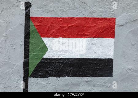 Childish style drawing, of the flag of Sudan, painted on a wall. Stock Photo