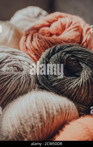 Close up of earth coloured coloured skeins of wool yarn, selective focus. Stock Photo