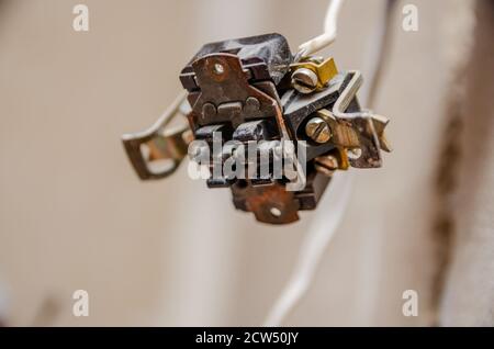 Electrician disassembling wall socket in new building, close up Stock Photo