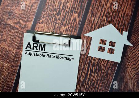 ARM - Adjustable-Rate Mortgage write on a paperwork isolated on office desk. Stock Photo