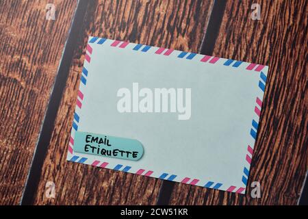 Email Etiquette write on a white envelope isolated on office desk. Stock Photo