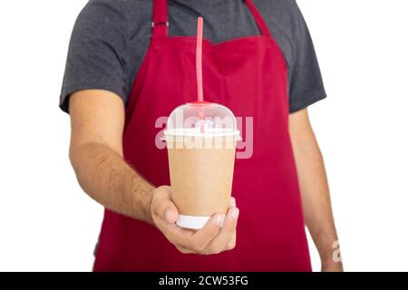Coffee takeaway at cafe shop concept, blank container, template. Barista in red apron holding coffee to go paper cup isolated against white background Stock Photo