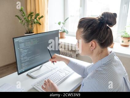 Female programmer working from home, remote, home office. Remote work concept - Image Stock Photo